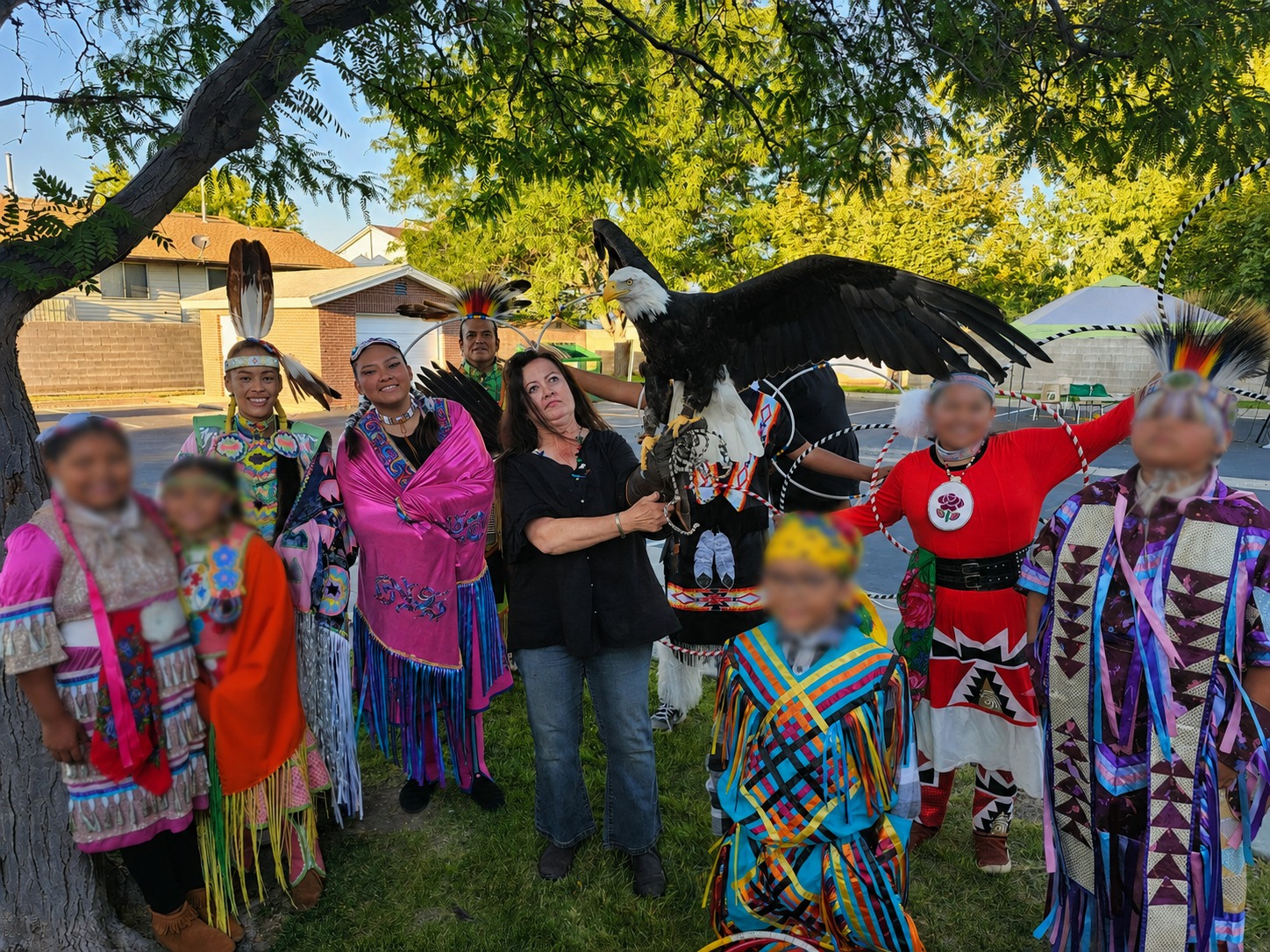 Community members gathered around a live Bald Eagle conservation program